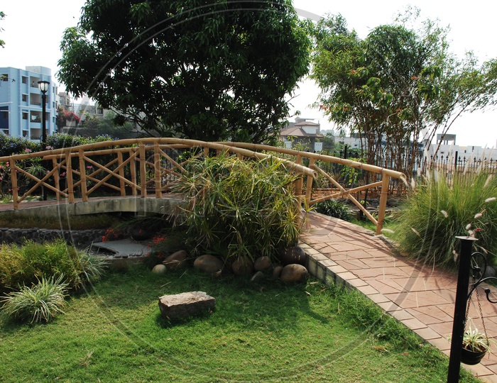 A Small Water Bridge In a Lawn Garden