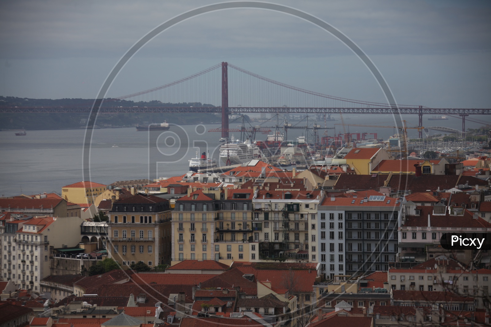 Buildings and Ponte De Abril suspension bridge on the left in Lisbon