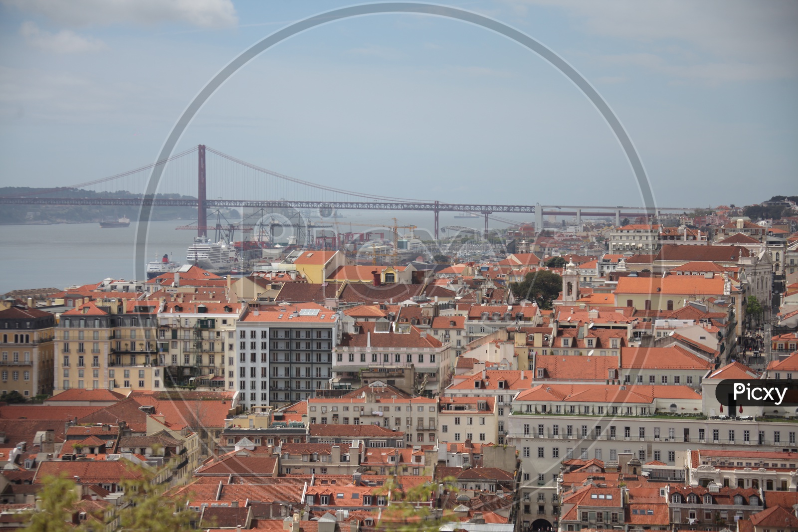 Lisbon city view and 25 De Abril suspension bridge to the left