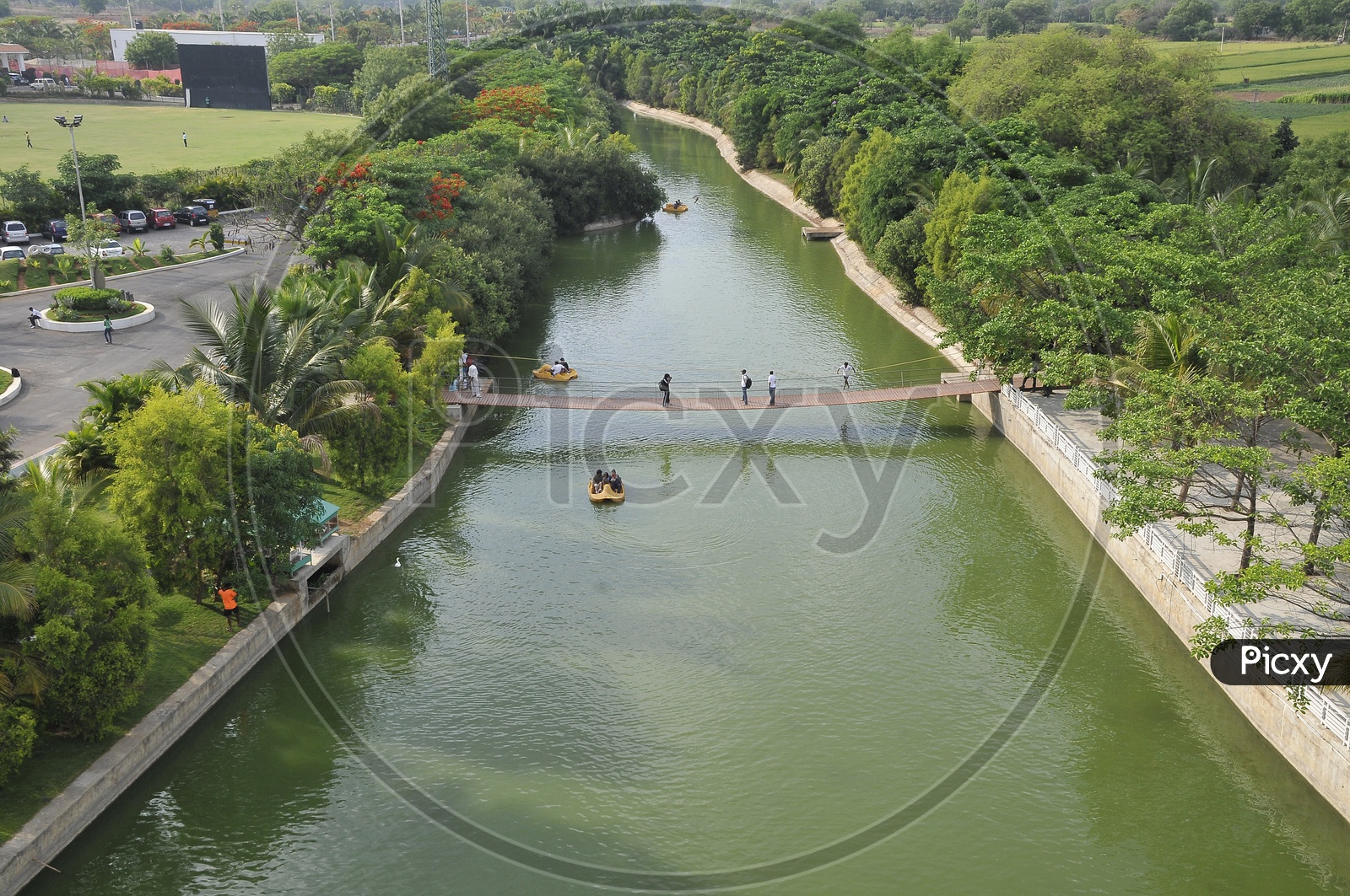 Aerial view of wooden bridge across a canal