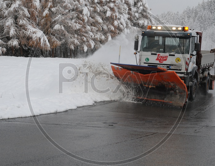 Snowplough clearing the snow from the road
