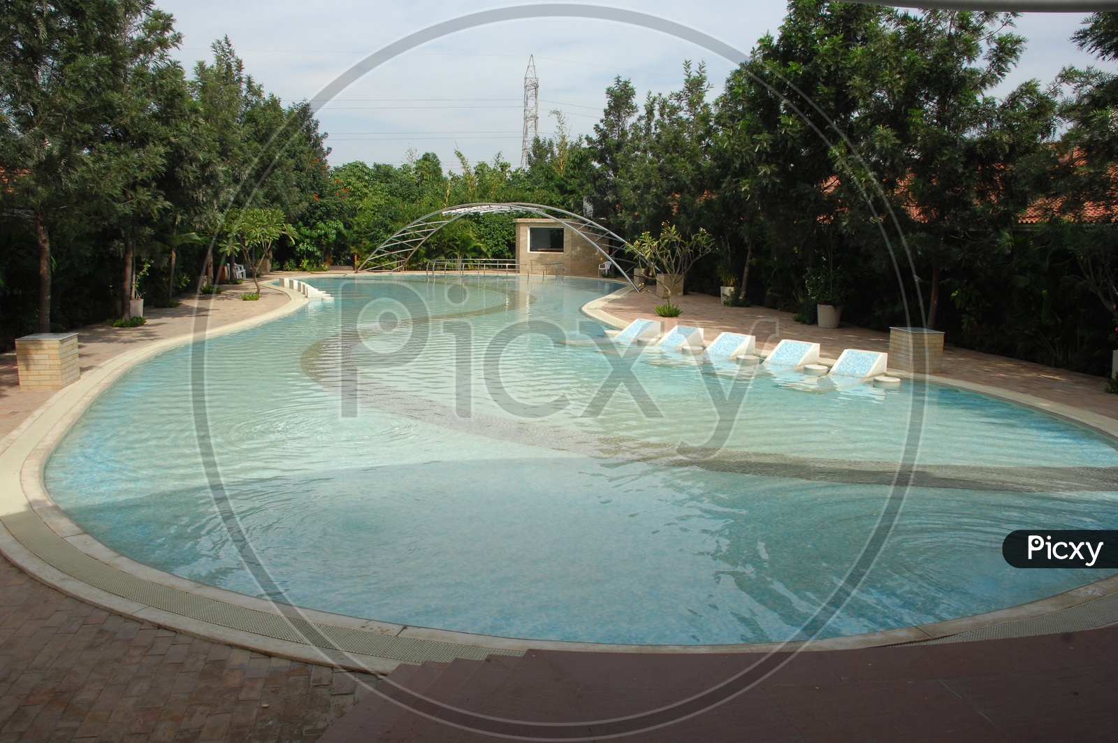 Swimming pool with an arch bridge in between
