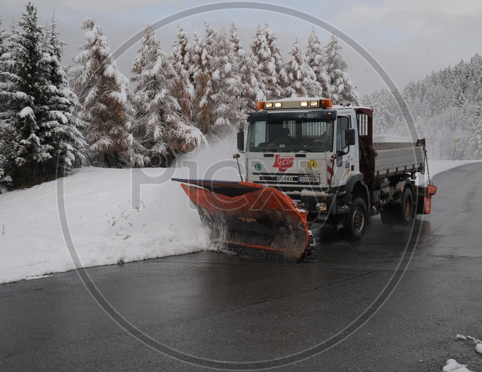 Snowplough clearing the snow on the road