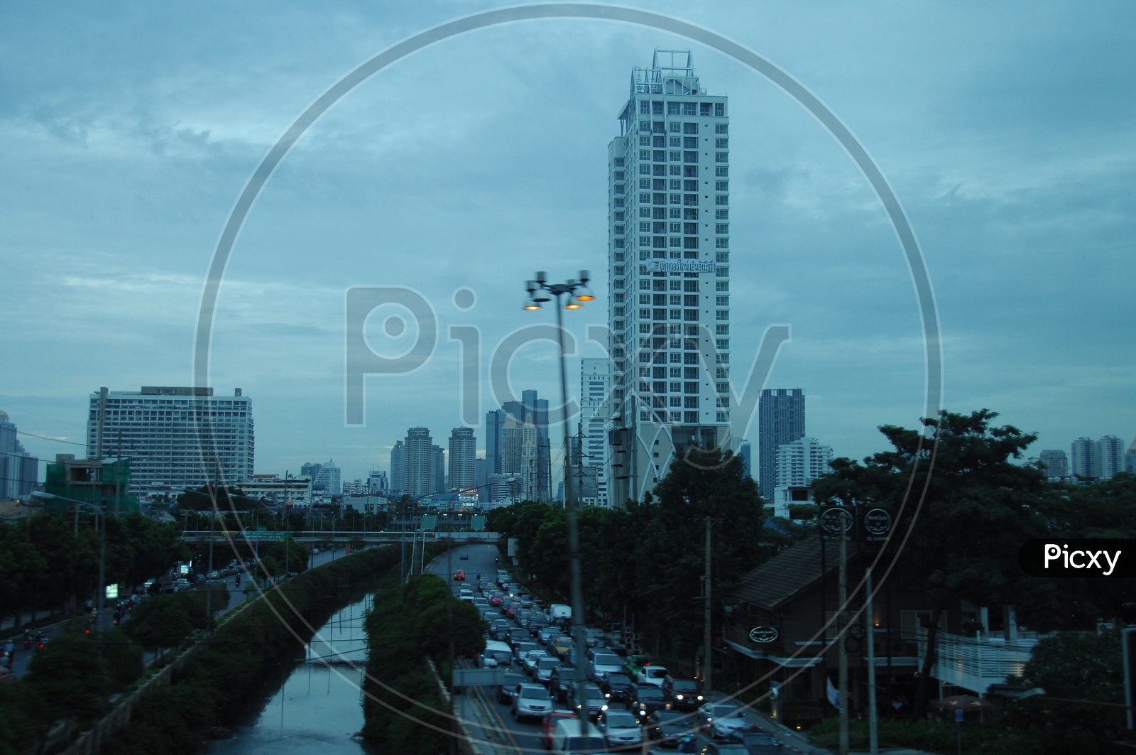 High rise buildings and vehicles moving on the road