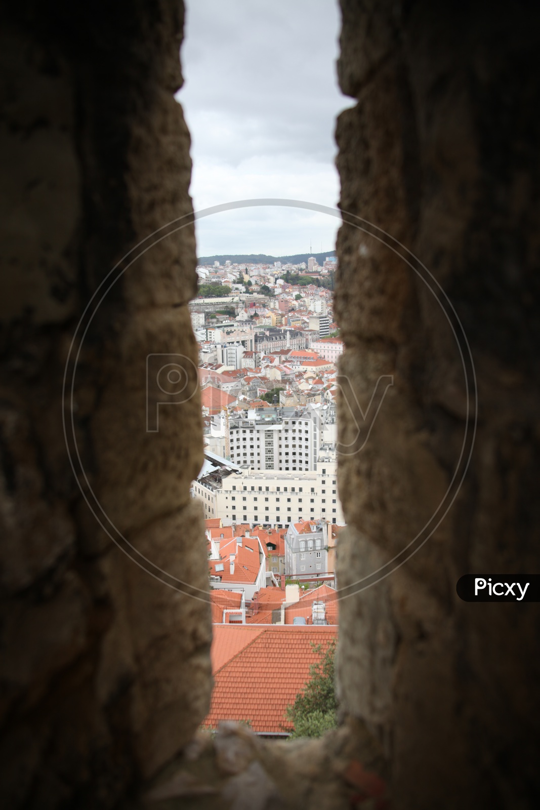 Lisbon City view through the stone walls