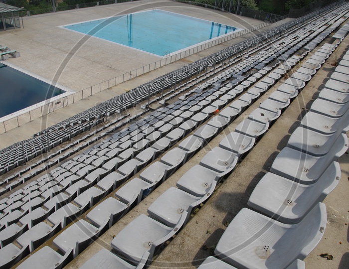 Seating arrangement of audience by the swimming pool