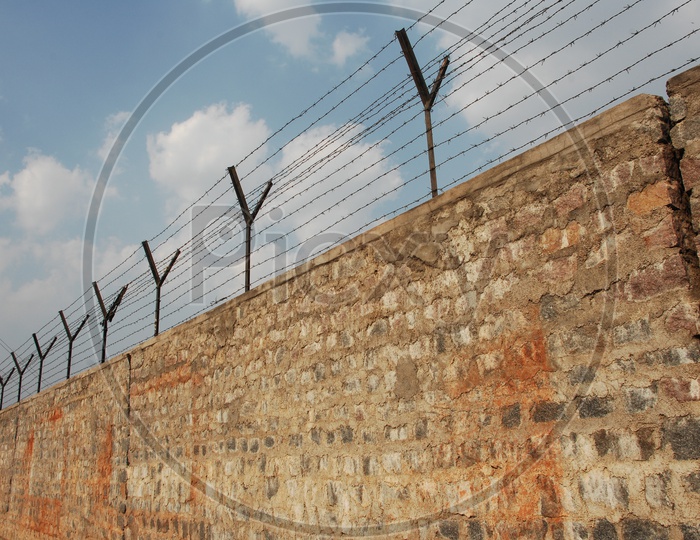 Razor Wire Fence On a Wall For Safety or Spike Metal Wire Safety Fence