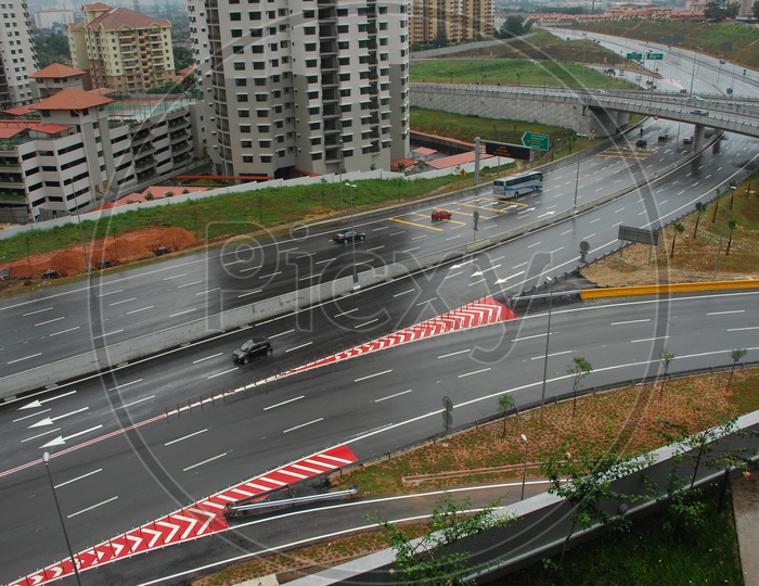 View of cars moving on the wet road