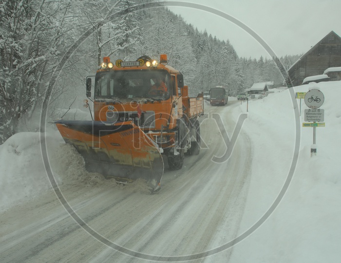 Snowplough machine clearing the snow