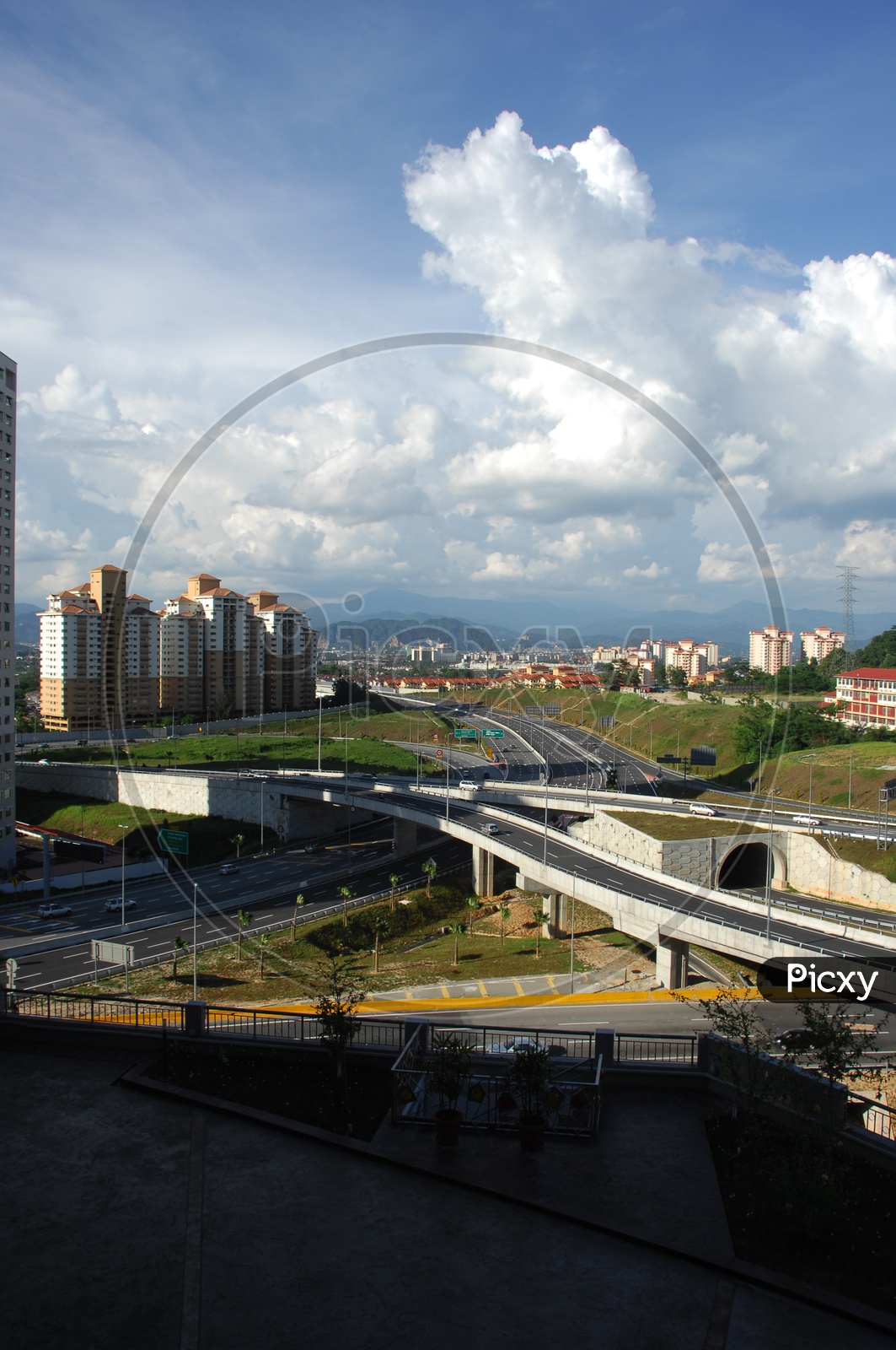 View of overpass alongside the city buildings