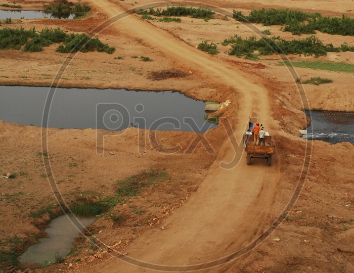 Tractor moving along the muddy road