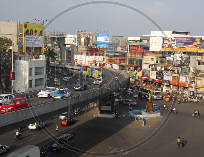vehicles moving on Nagarjuna circle fly over and on the road