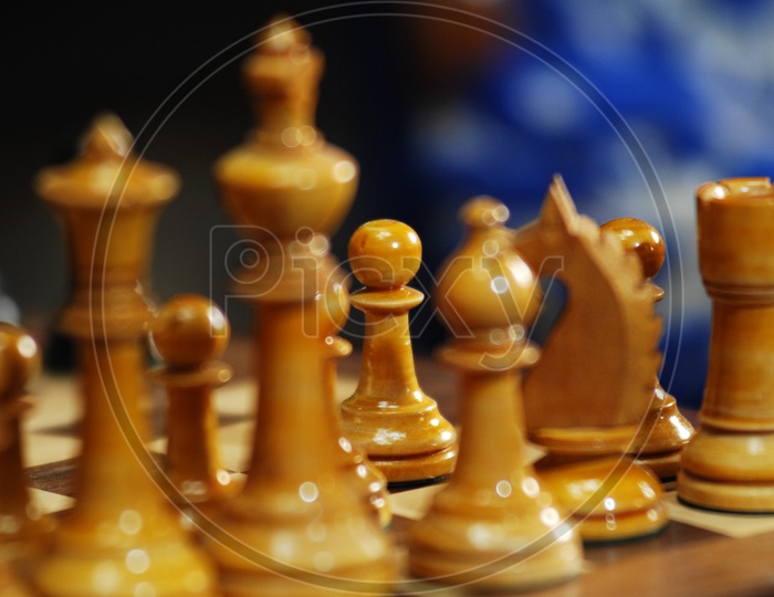 Wooden chess pieces on a chess board