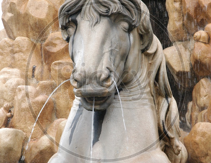 Water coming out from the horse statue