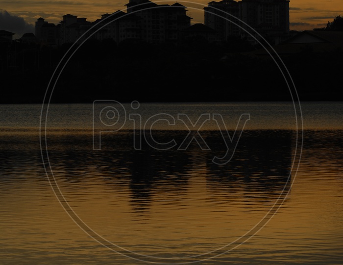 Evening orange sky with water reflection