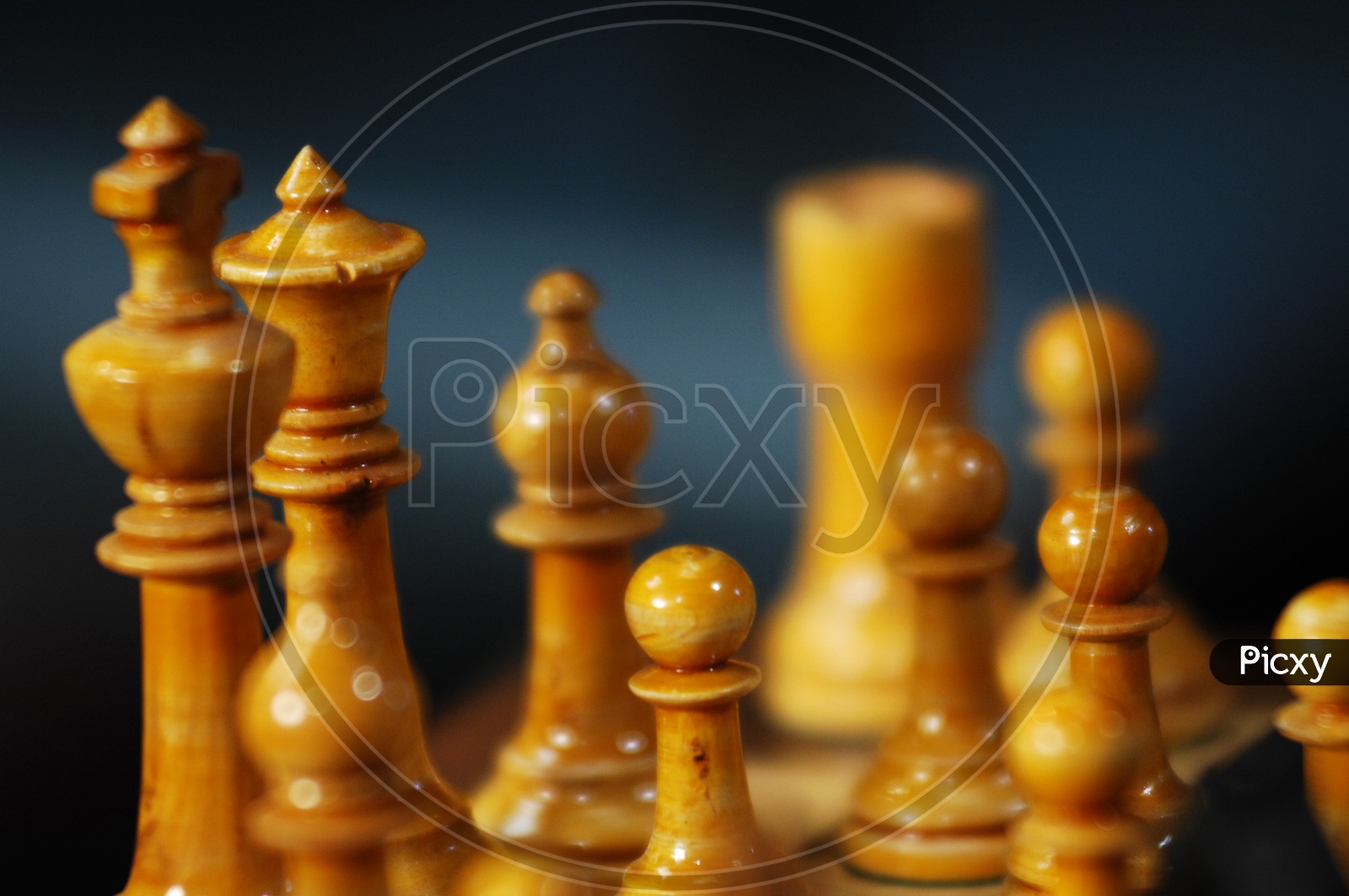 Wooden chess pieces on a chess board