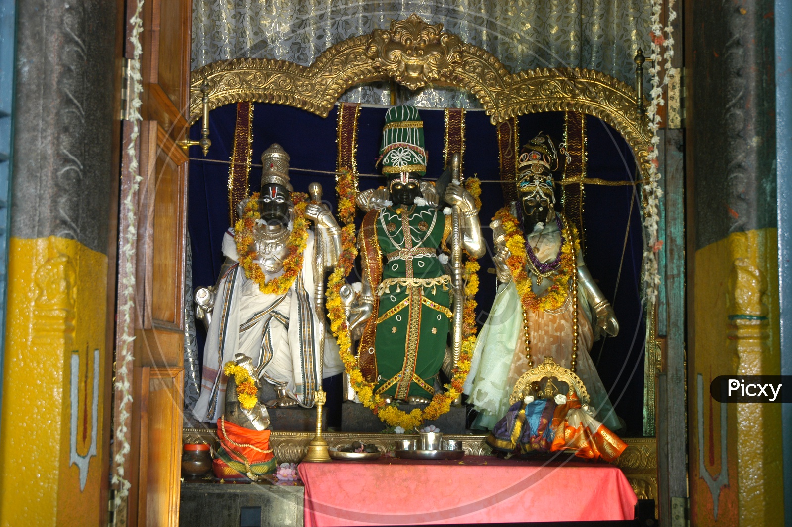 Hindu God statues decorated with garlands