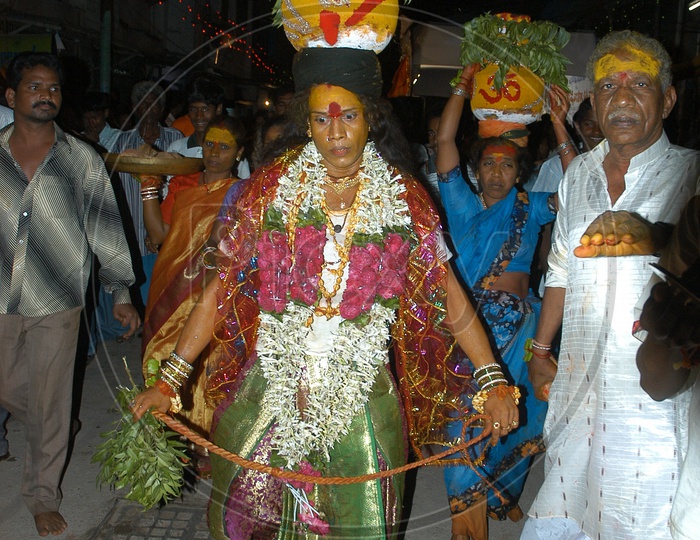Indian Devotees Carrying Bonalu