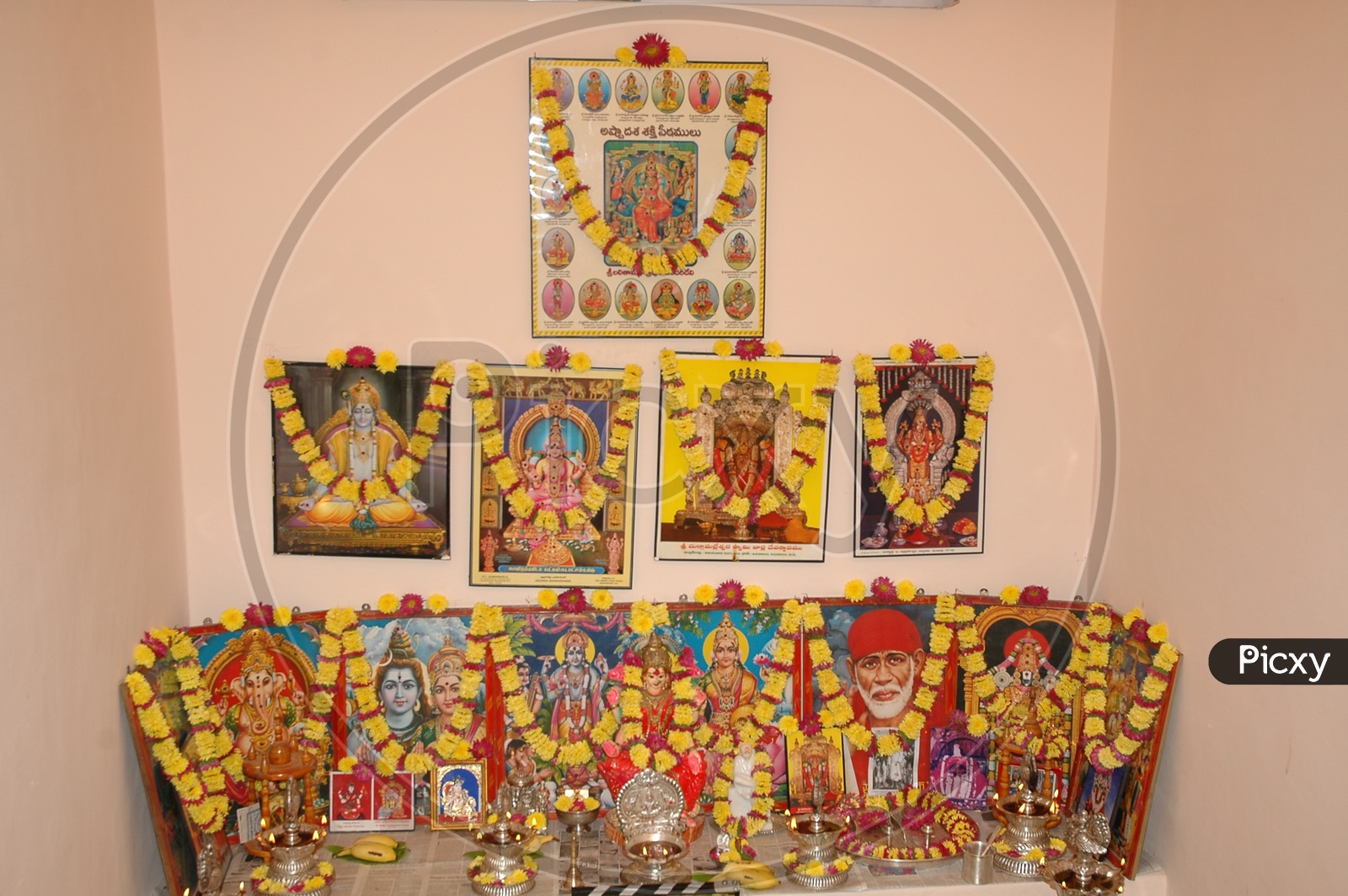 Image of Hindu God Photo frames decorated with garlandsPP407916Picxy