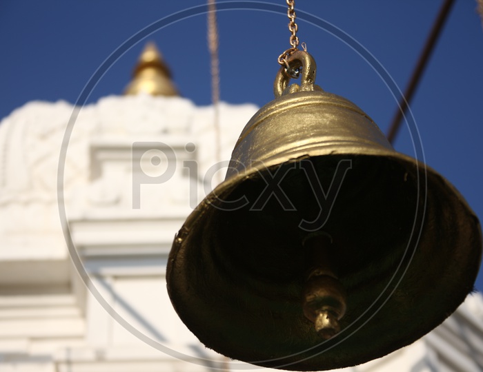 Temple Bells with Gopuram in background
