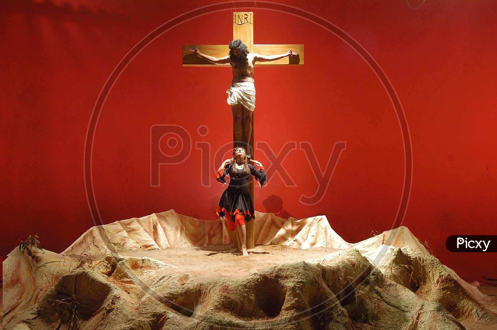 People performing Jesus crucification during a christian skit