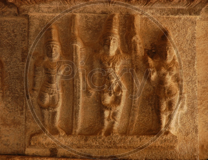 Stone carving of Hindu Gods on the wall