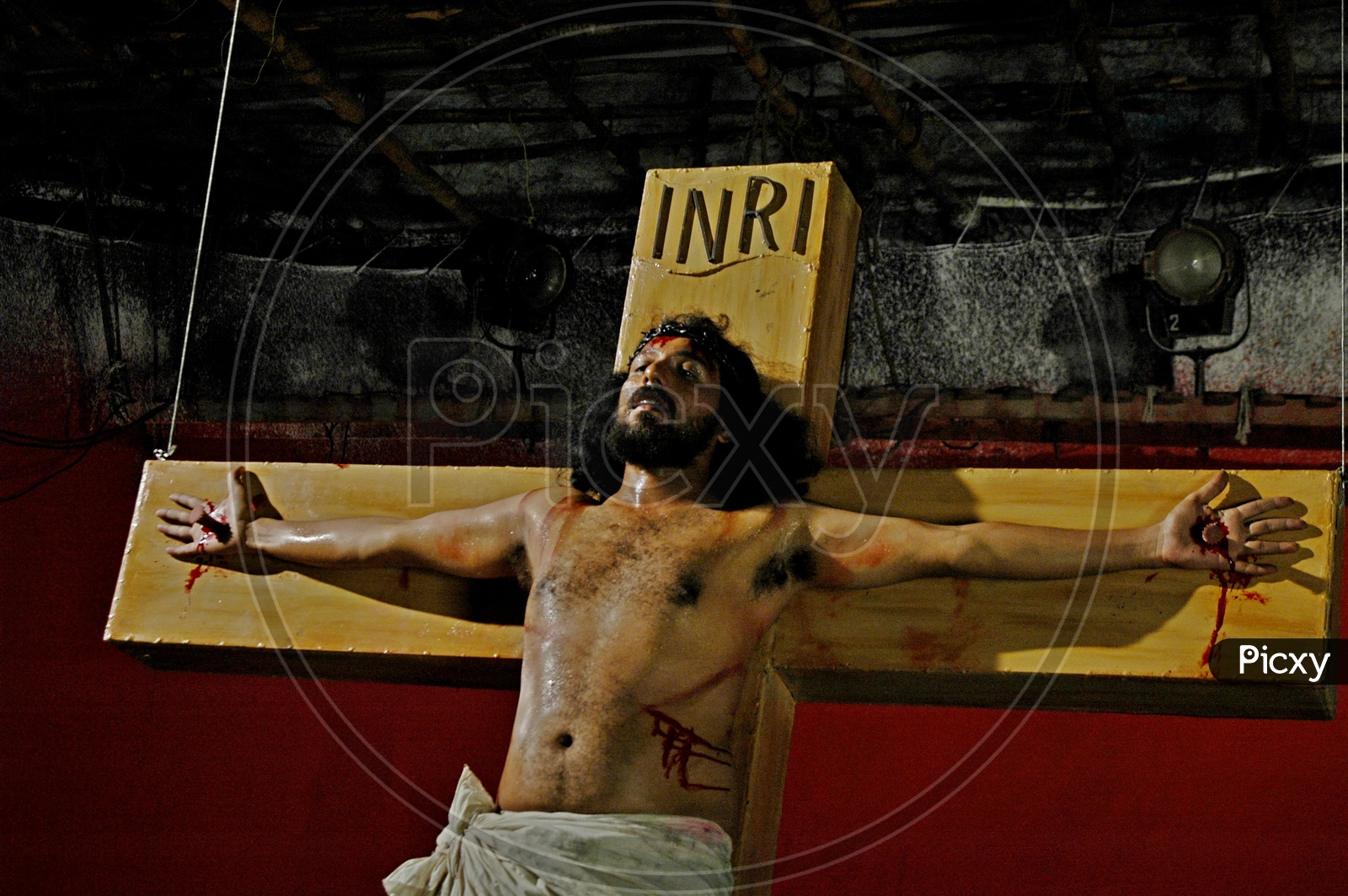A man playing Jesus crucification during a christian skit
