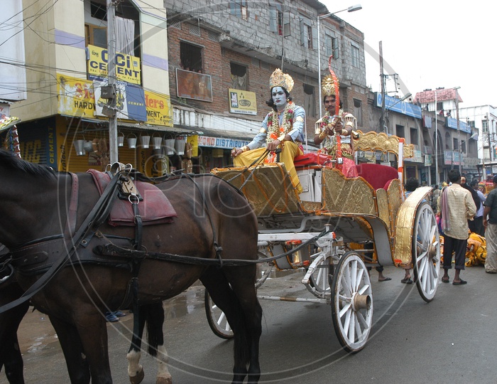 Indian man In Lord Krishna Makeup Riding a Chariot