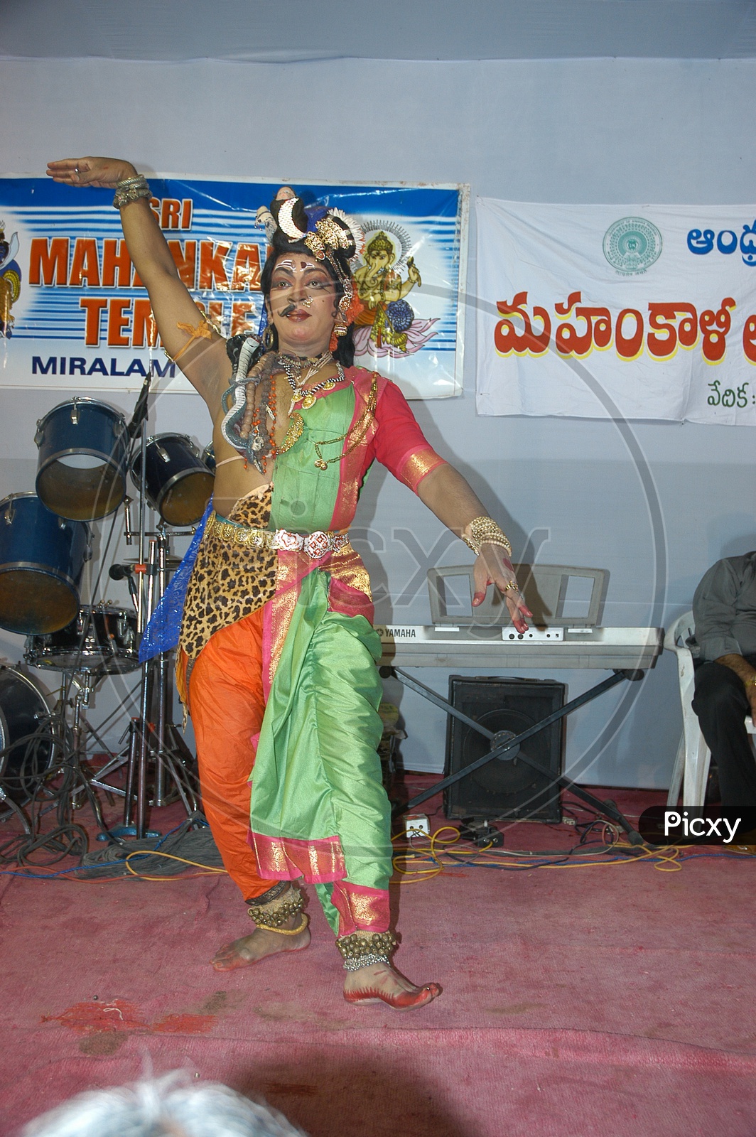 An Artist Performing Ardha Naariswari Dance On  A Stage