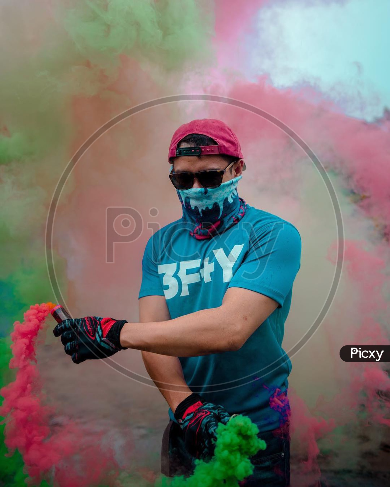 a person wearing a mask with smoke bombs in the hand