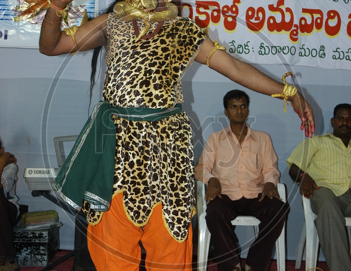 An Artist In Lord Shiva Getup Performing on Stage