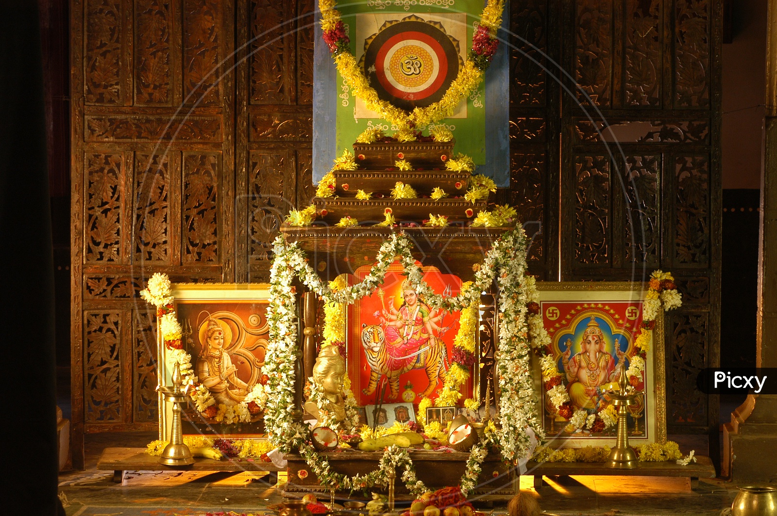Hindu God Photos decorated with flowers and garlands