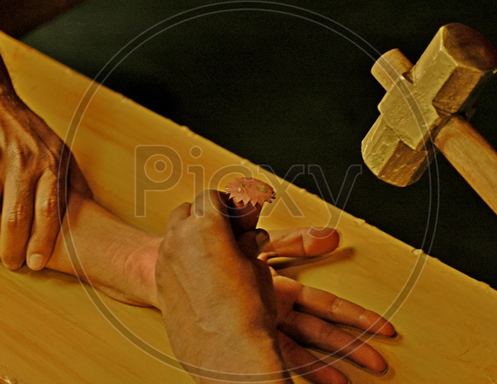 Image of Hammering a nail into the Man's hand during a christian skit