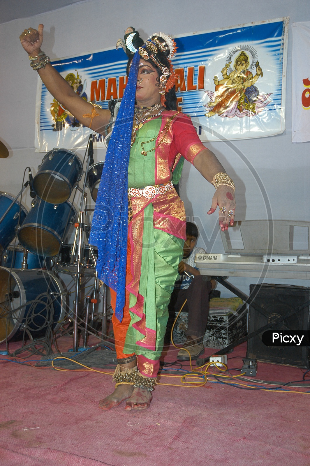 An Artist Performing Ardha Naariswari Dance On  A Stage