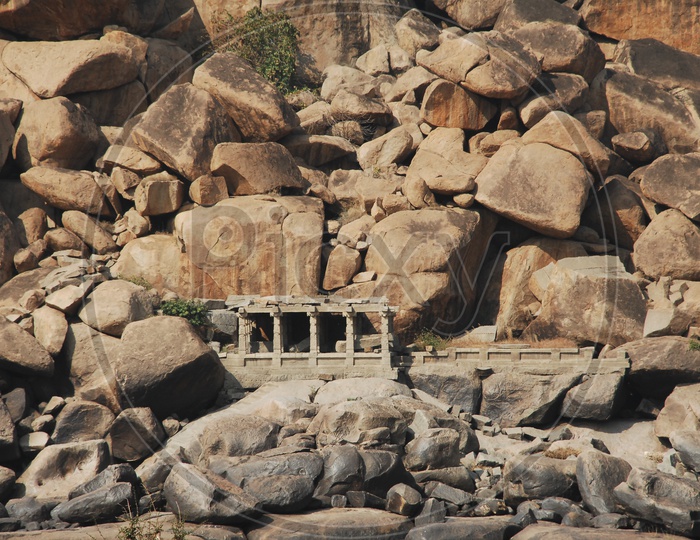 Hampi temple ruins in between the mountain rocks