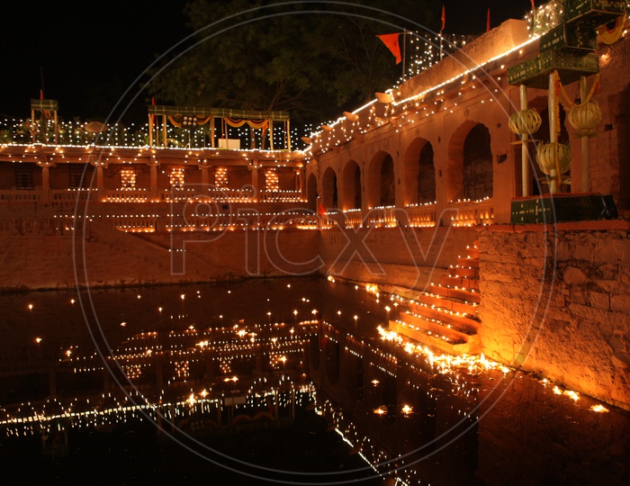 Temple Kolan with lights and diyas in the night