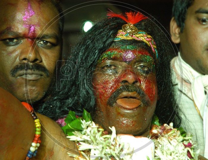 Costumed men during Bonalu festival