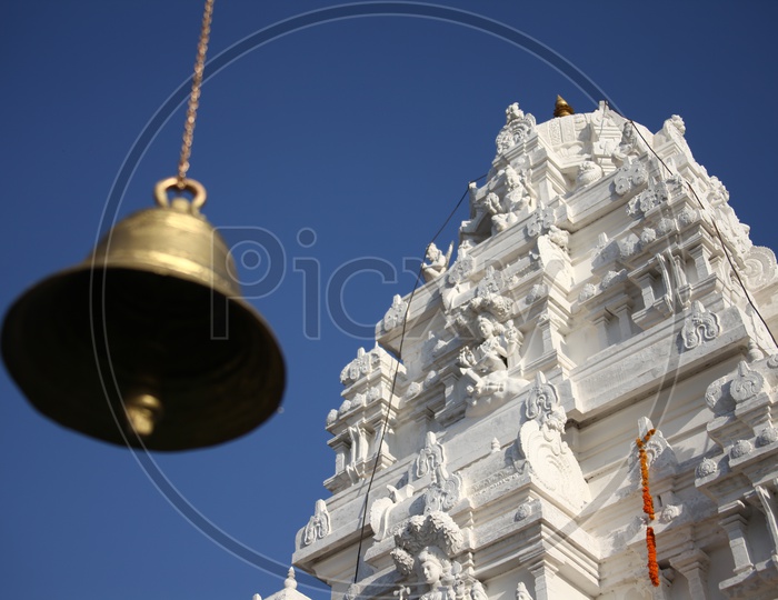 Temple Bells with Gopuram in background
