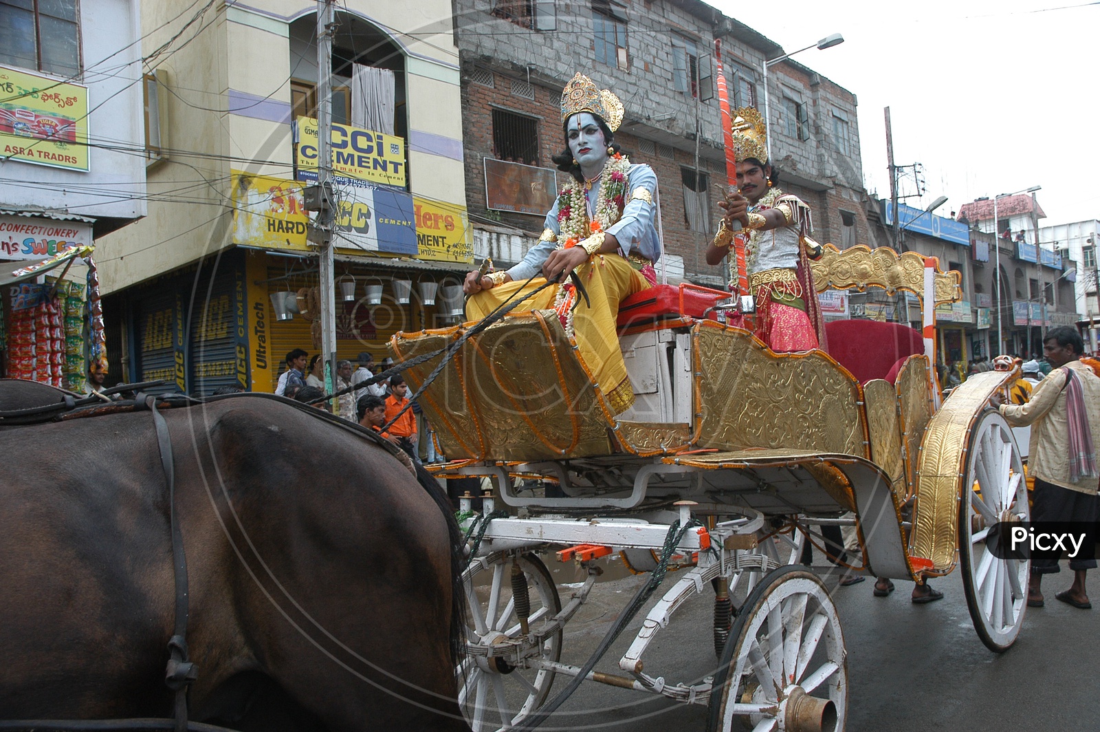 Indian man In Lord Krishna Makeup Riding a Chariot