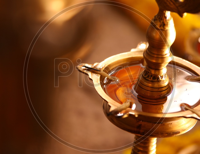 Brass diya with oil