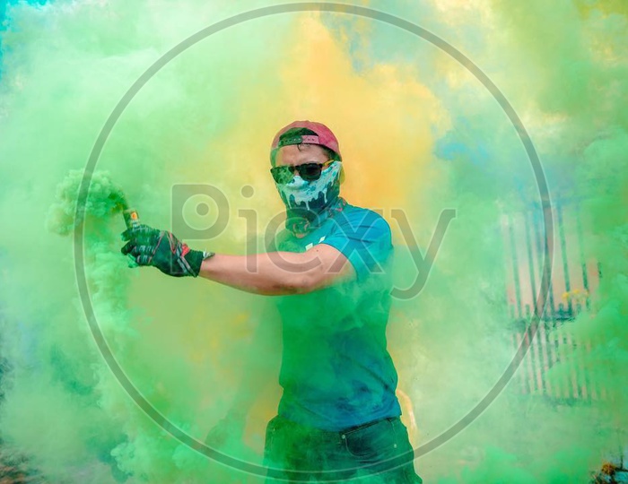 A person with a smoke bomb in the hand
