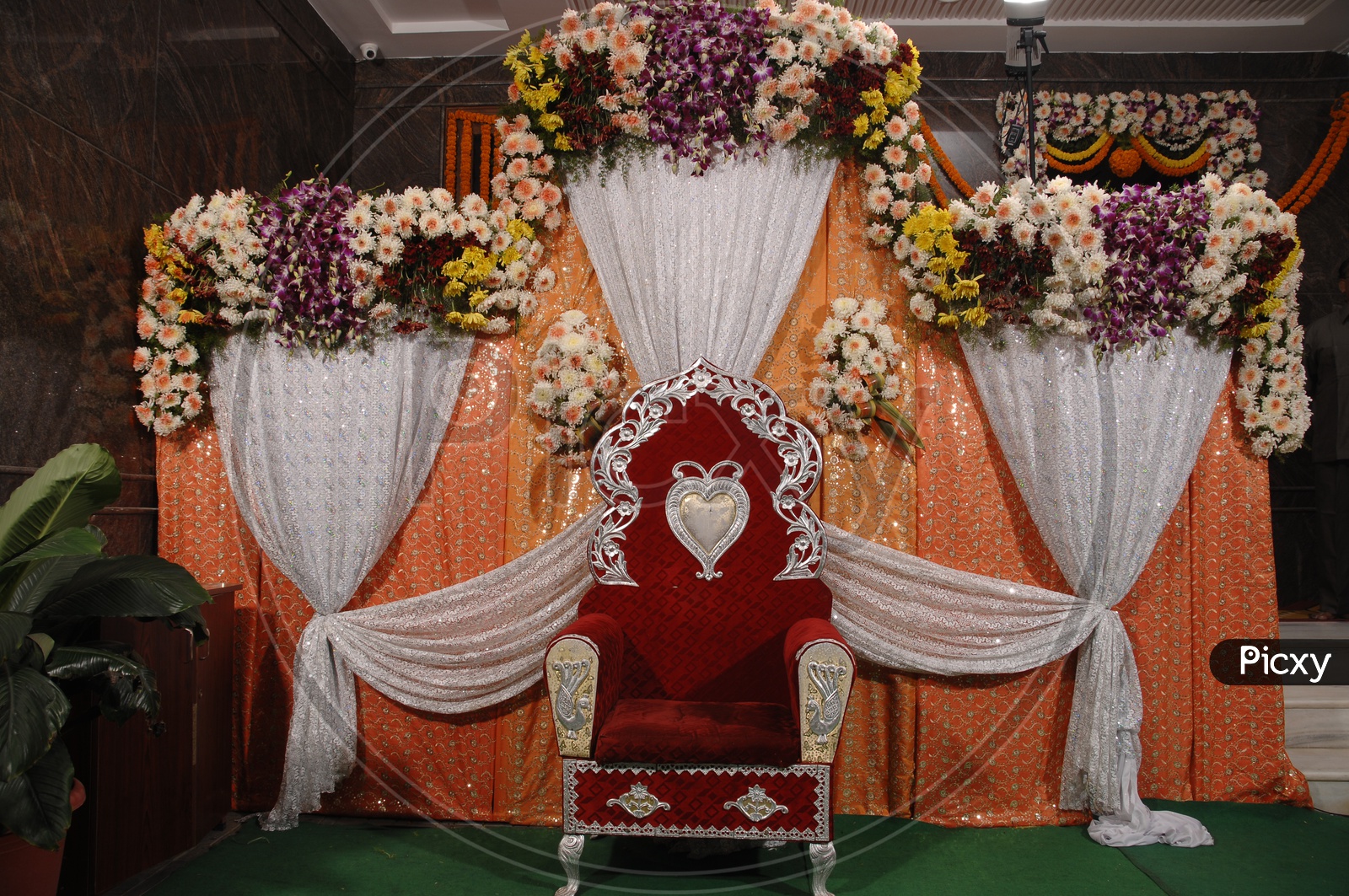 Flowers Decoration of a stage / Dias and chair on it
