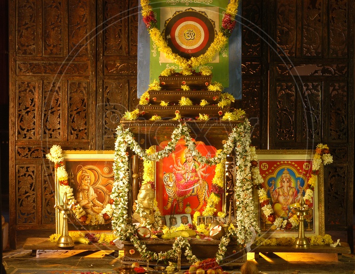 Hindu God Photos decorated with flowers and garlands