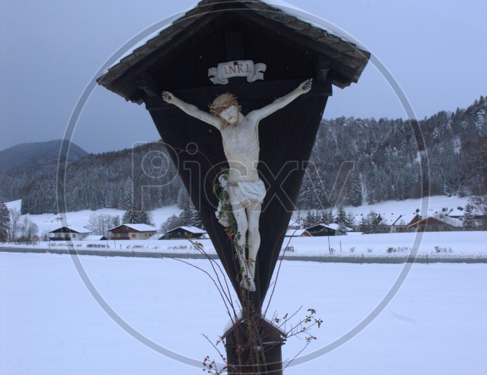 Jesus Crucification Statue in the snow