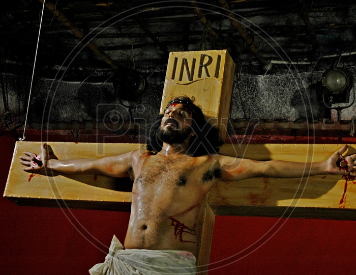 A man playing Jesus crucification during a christian skit