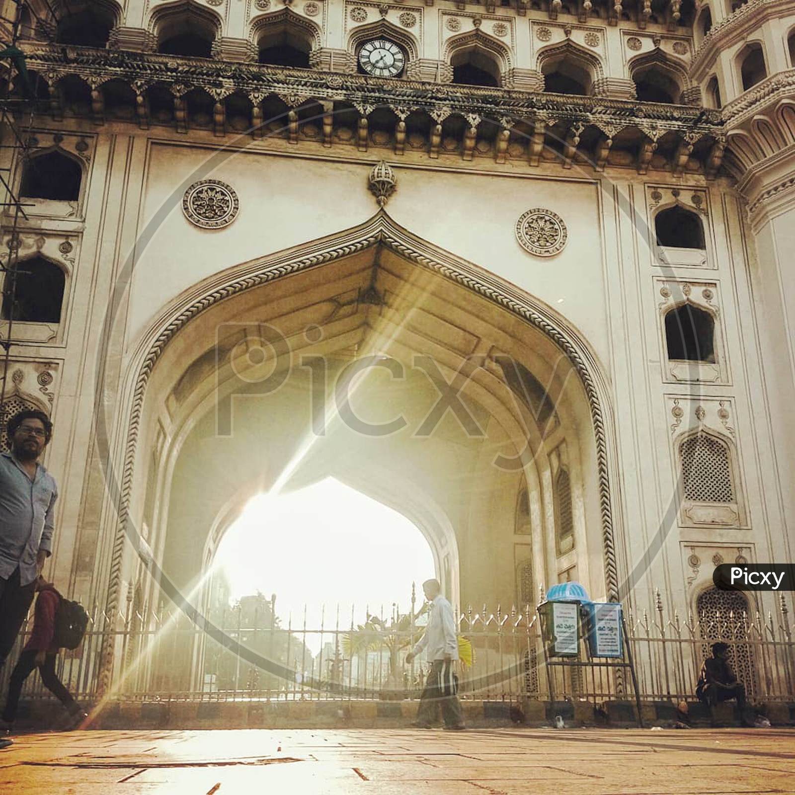 sunrise at charminar and people moving around