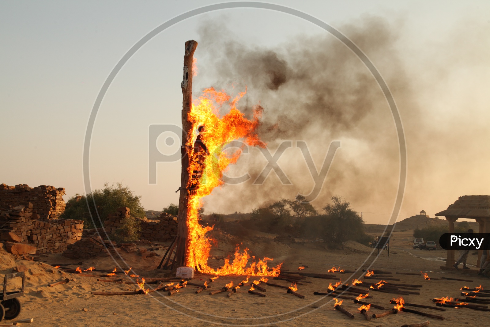 A man is burnt tied to a pillar in Agitation