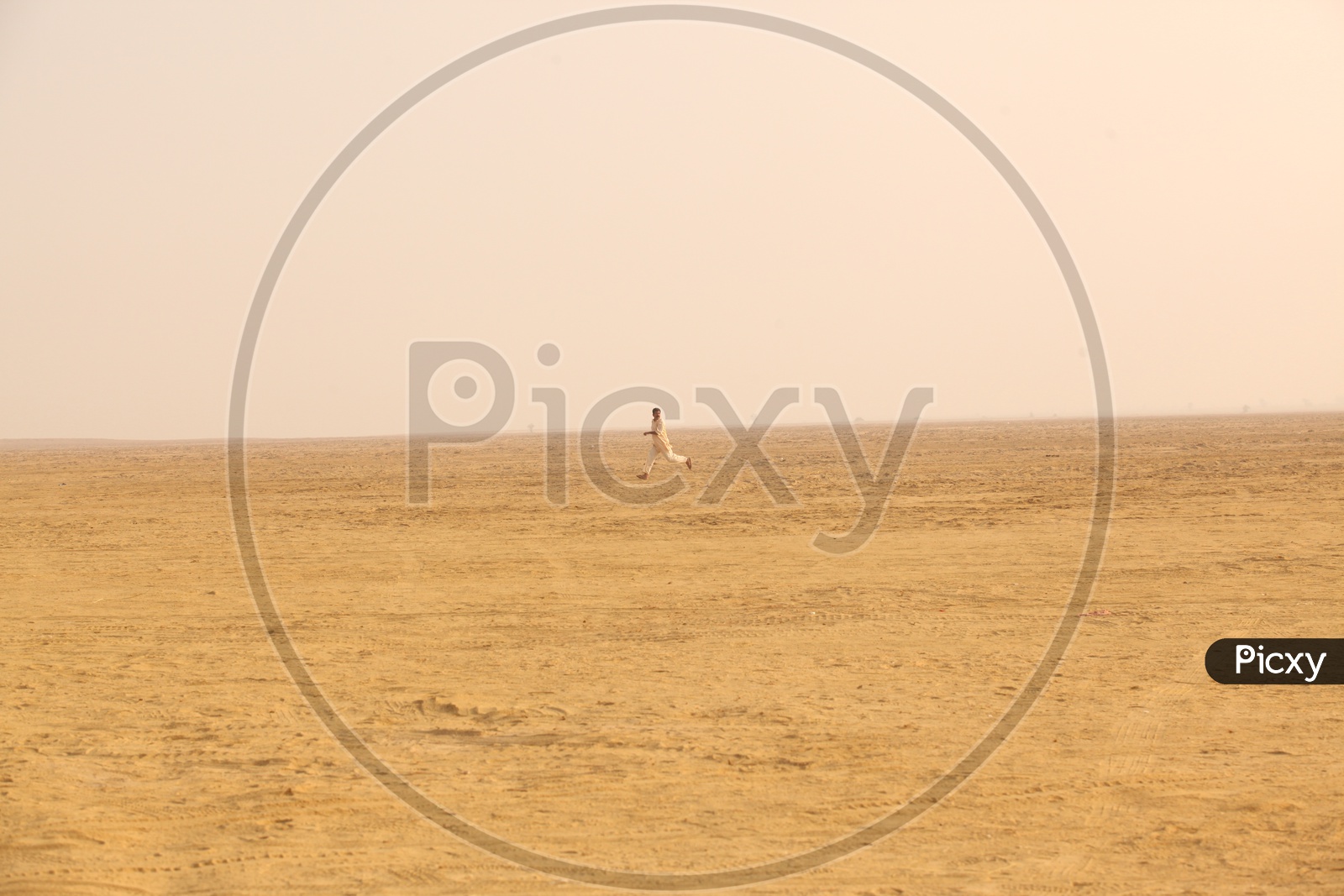 Indian man running in a Desert