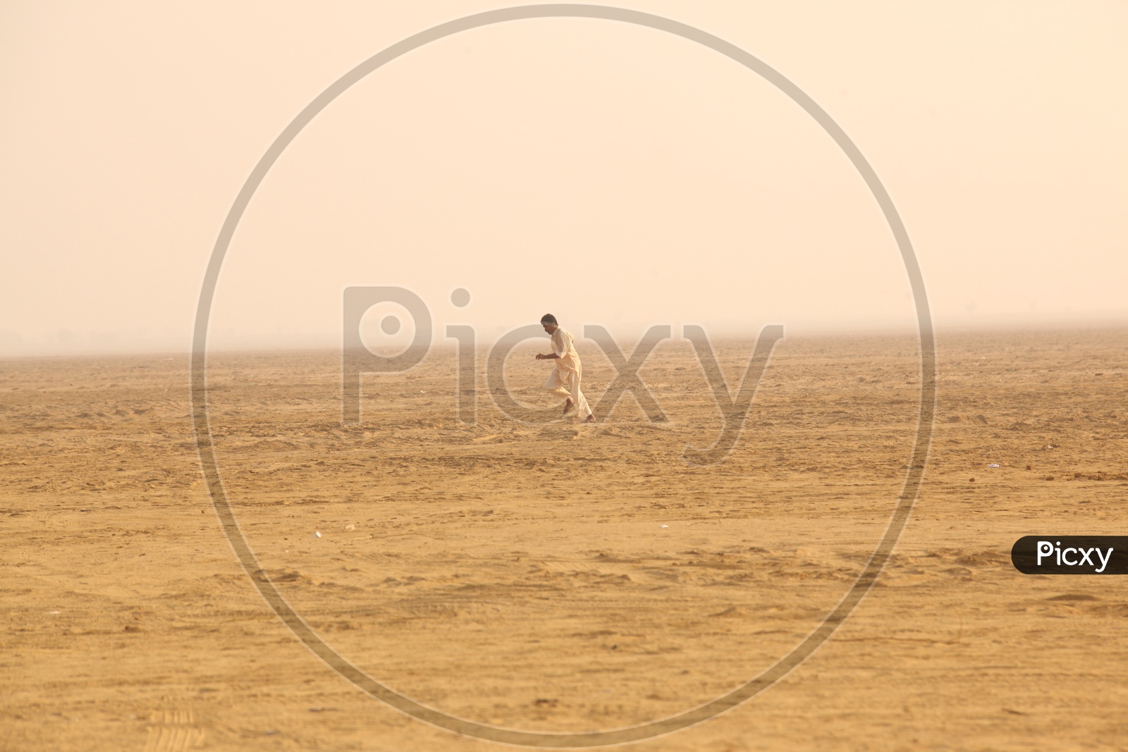 Indian man running in a Desert