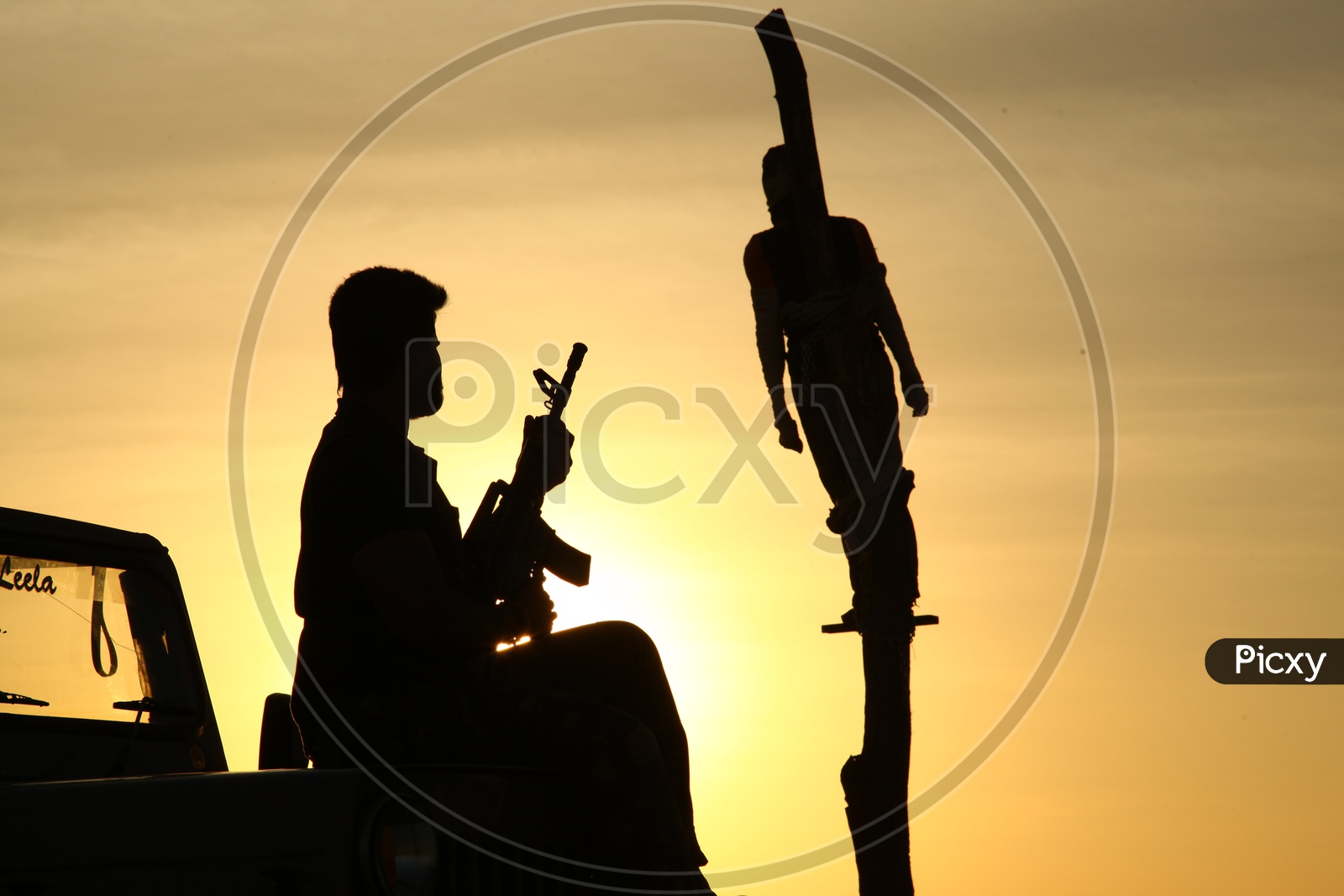 silhouette of a person with a gun